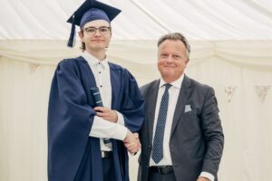 CEO Tim fish awards scrolls