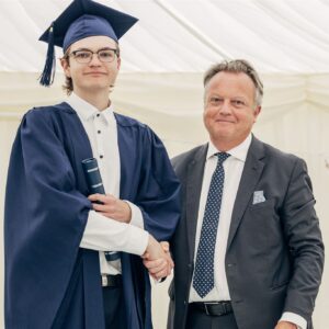 CEO Tim fish awards scrolls